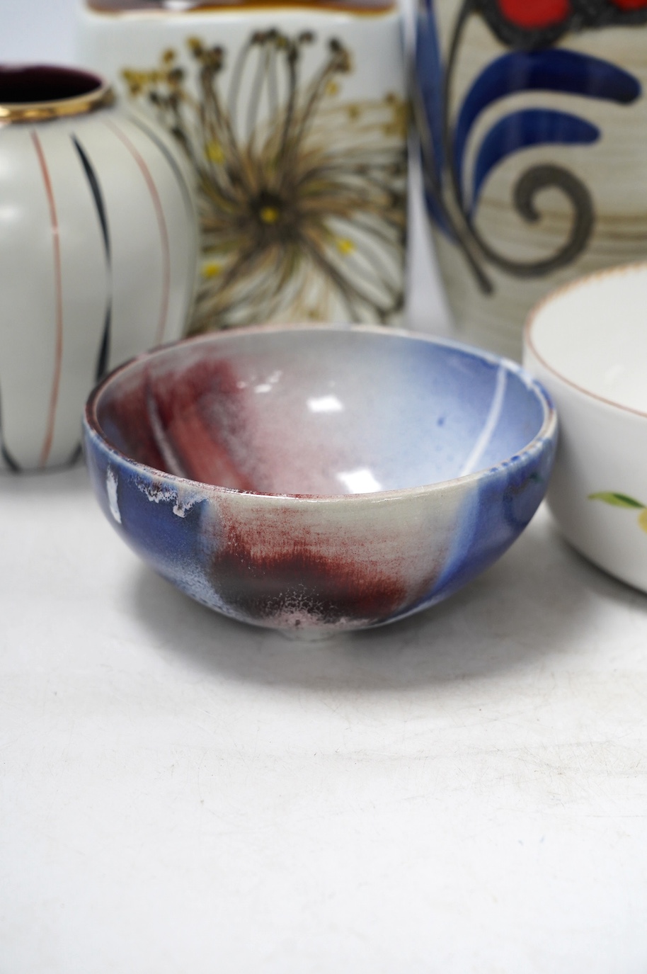 Five ceramic items including a Royal Copenhagen vase, 19cm, two West German vases, tallest 34.5cm, a studio pottery bowl and a Dresden bowl. Condition - good